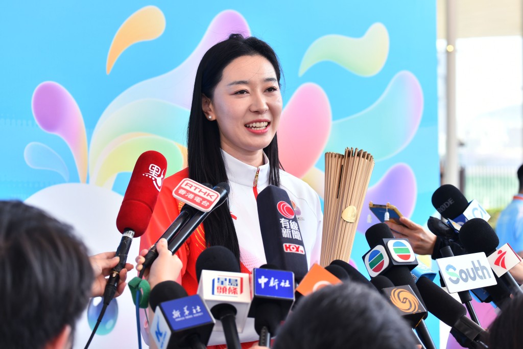 孫一文今晨3點起床準備火炬跑。盧江球攝 孫一文今晨3點起床準備火炬跑。盧江球攝