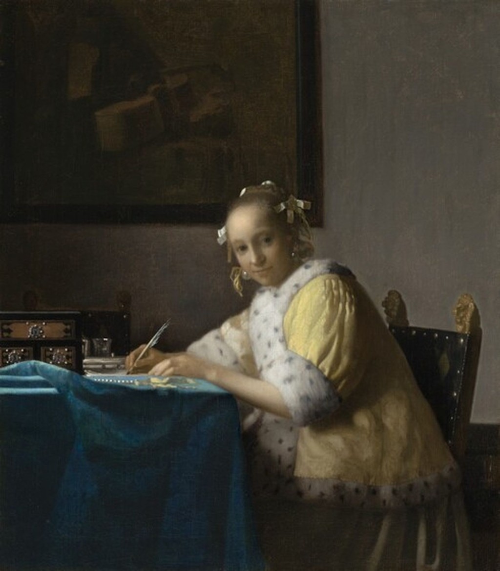 维梅尔画作《写信的女子》。