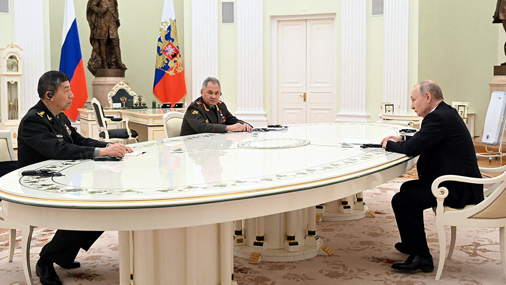 今年4月，俄羅斯總統普京會見李尚福。路透社