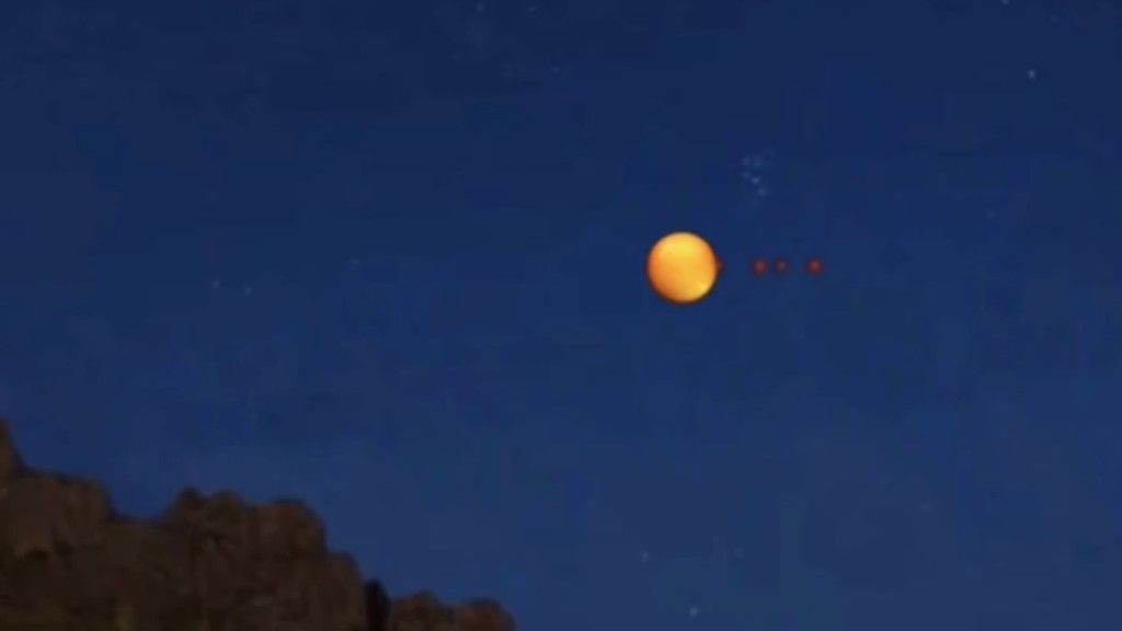 根據UFO目影證詞生成的AI影片:幾個紅點等距出現在「大陽火球」旁。 根據UFO目影證詞生成的AI影片:幾個紅點等距出現在「大陽火球」旁。