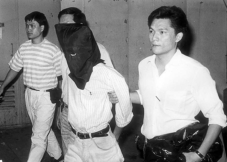 當年其中一名龍蝦灣謀殺案疑犯被警方拘捕。資料圖片