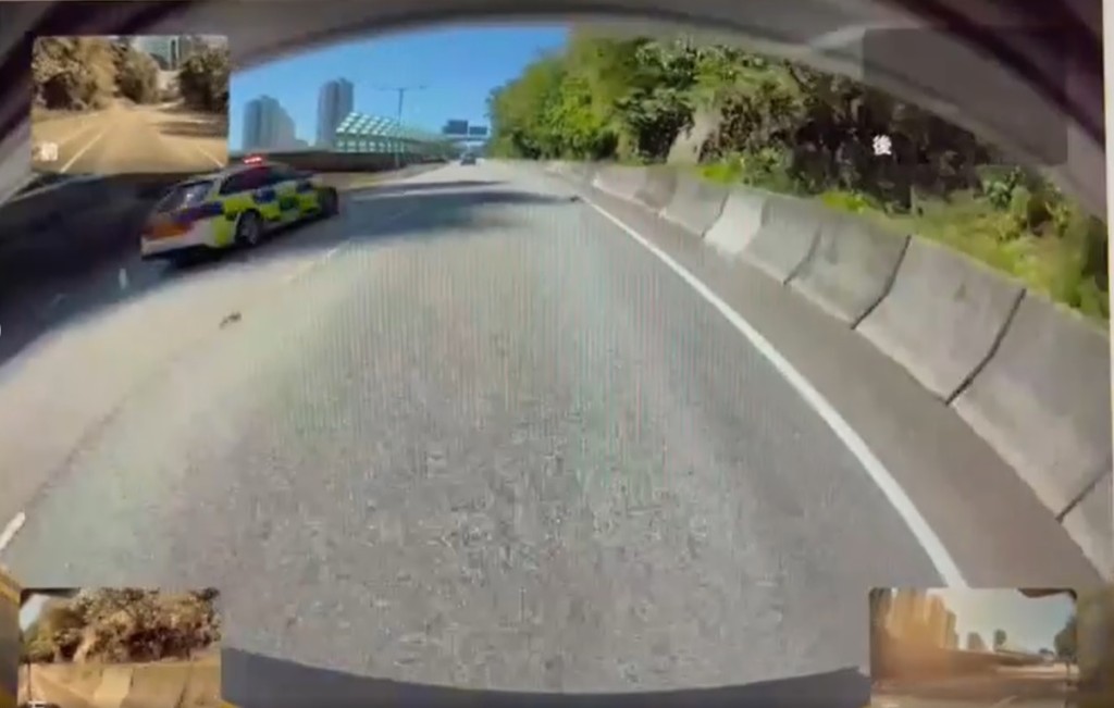 車cam顯示一輛私家車在屯門公路逆線行駛，尾隨有警車追截。(香港突發事故報料區影片截圖)