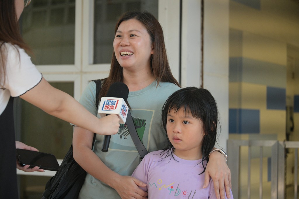 全民运动日︱刘小姐指女儿一直有游泳习惯，故并非因免费专程到场。