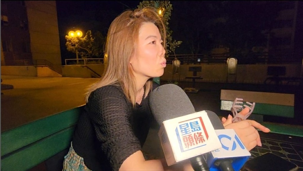 寇小姐因停電無法入睡,與姐姐步行17層落樓乘涼聊天,打發時間。黎志偉攝 寇小姐因停電無法入睡,與姐姐步行17層落樓乘涼聊天,打發時間。黎志偉攝