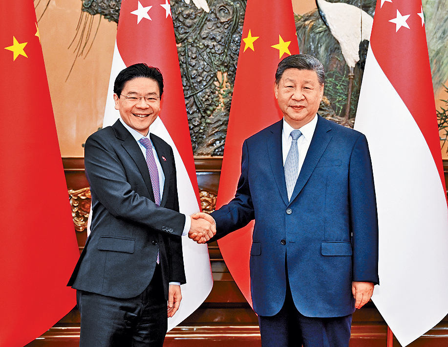 習近平會見新加坡總理黃循財(左)。