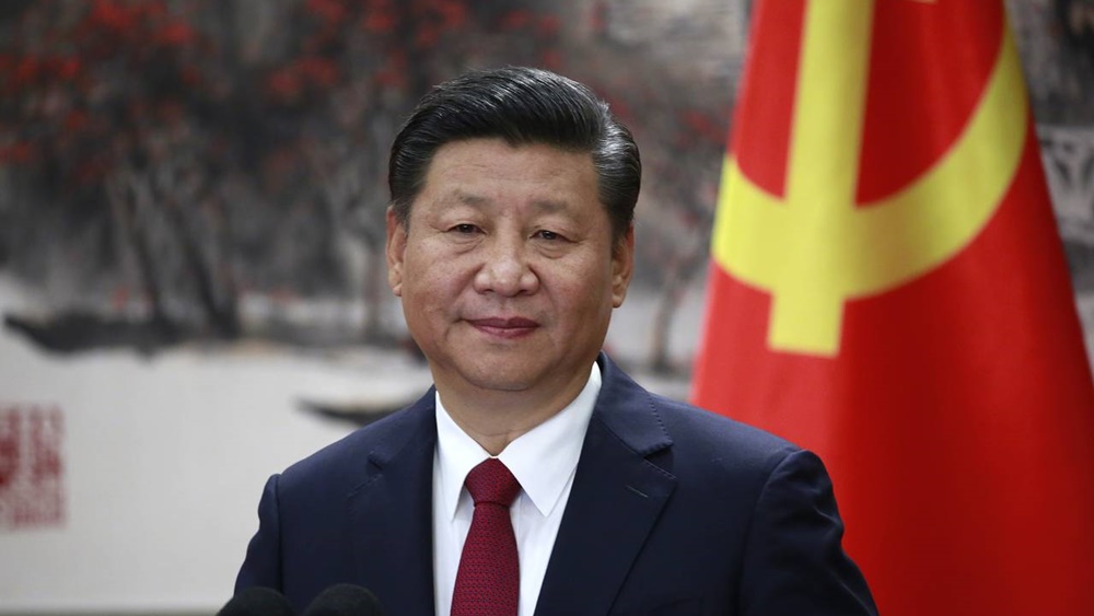 經習近平提議,與會者全體起立默哀。資料圖片