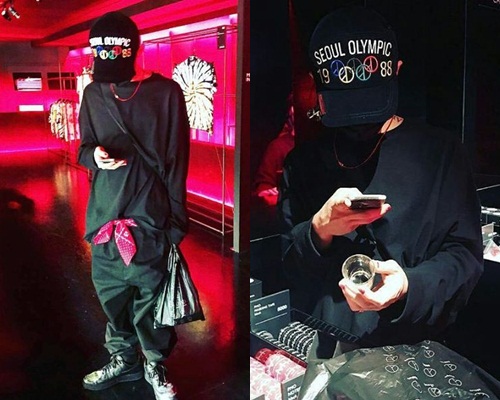 一身黑的GD在店內不停拍照。