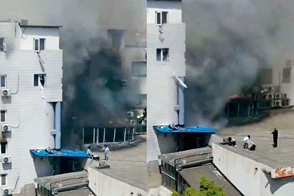 北京长峰医院起火，有医护抓住牀单试图从窗口逃生。