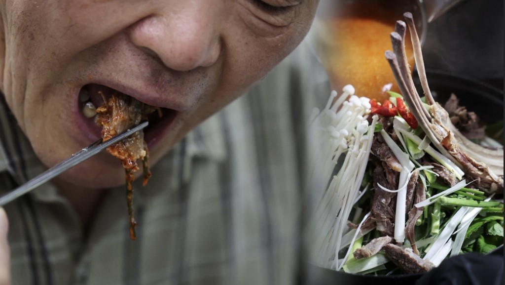南韓民眾在三伏天吃狗肉料理。 路透社