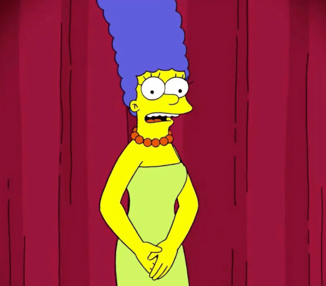 安柏自嘲如果戴上蓝色假发，就像卡通人物玛吉·辛普森（Marge Simpson）。