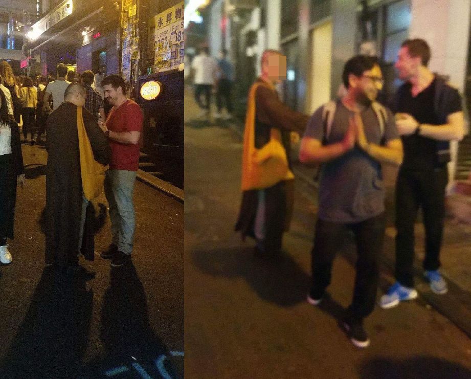 两名内地男子昨晚在兰桂坊假扮和尚，并向途人兜售佛。翁静晶 fb