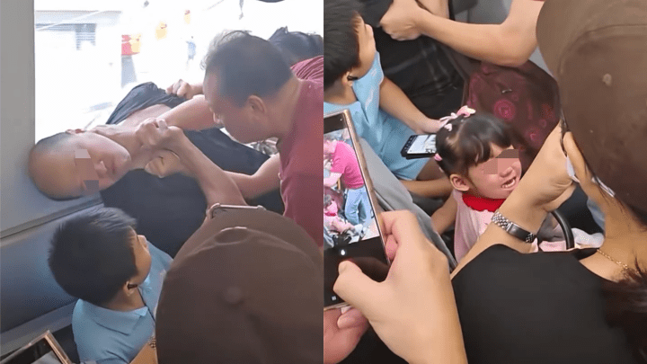 紅色男叉頸施襲，禿頭漢被打至坐下，在旁女童受驚哭泣。網片截圖