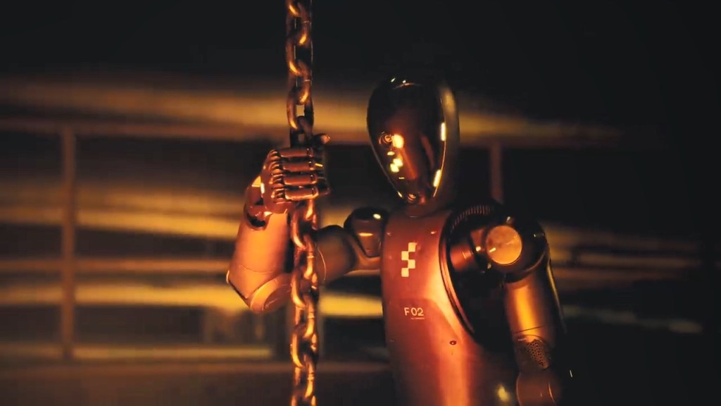 机械人依靠事前训练的动作模型，自主跃入熔炉。Figure AI