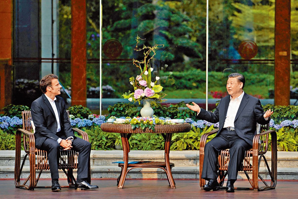 习近平与马克龙昨日在广州松园非正式会晤。