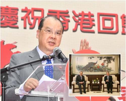 小圖，張建宗（左）與王光亞會面。