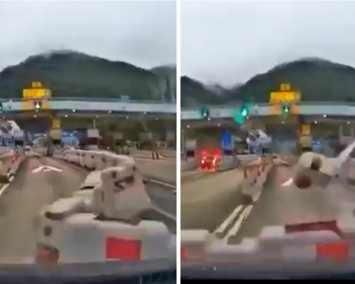 隧道收費亭前水馬被吹出行車綫被私家車撞。