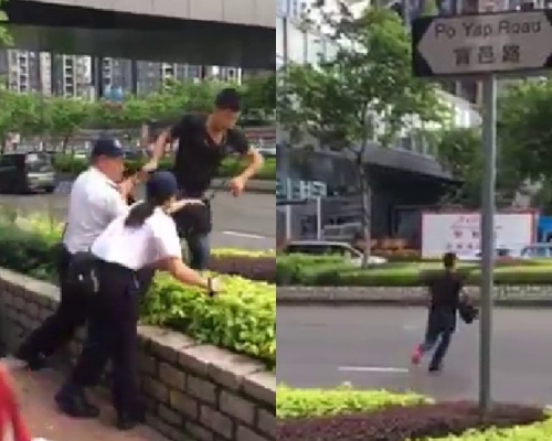 疑違規遭食環檢控，男子橫過馬路衝紅燈「走佬」。影片截圖