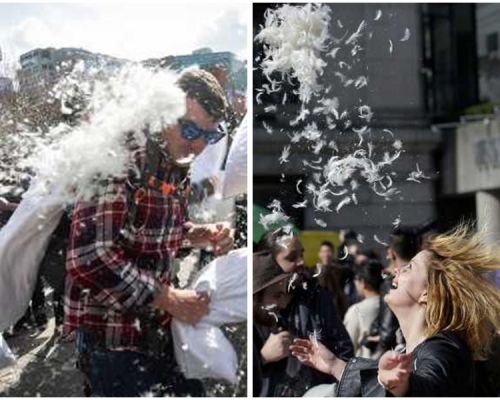 各人手執枕頭與旁人「激戰」。AP/新華社