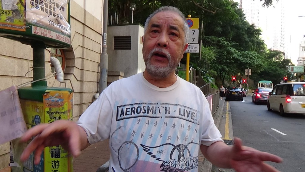 死者弟弟。 黃文威攝