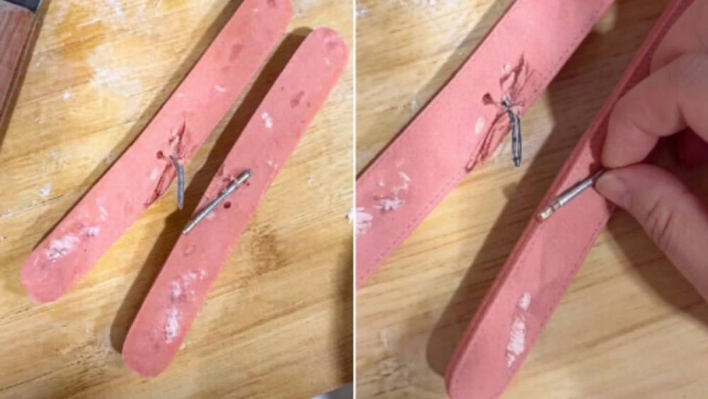 山西男吃雙匯火腿腸驚見藏兩鋼釘。