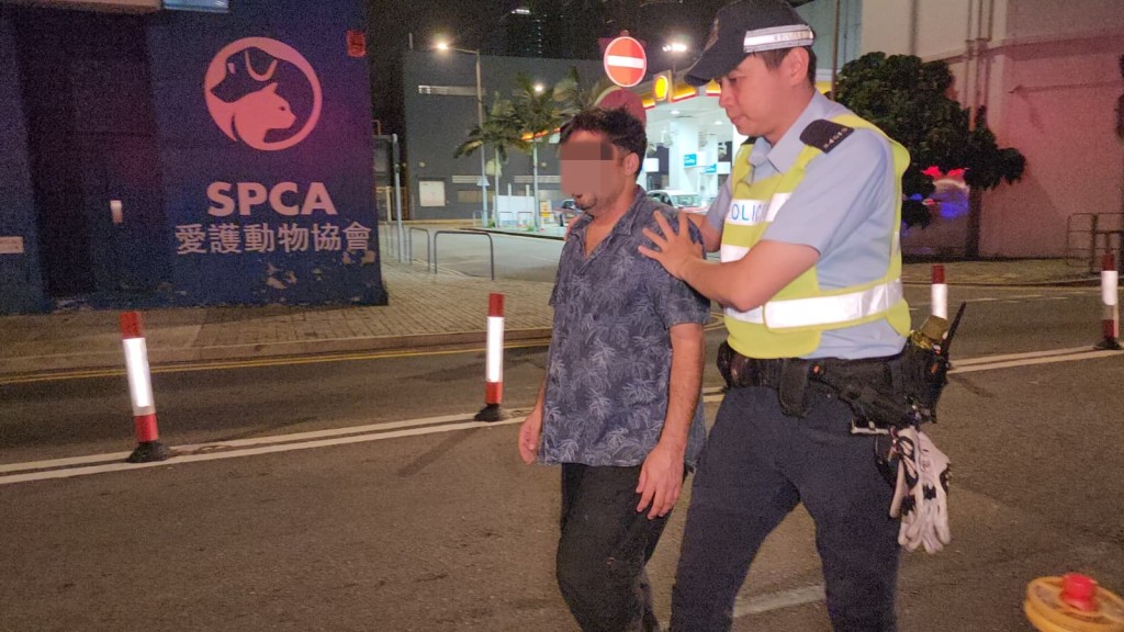 少年的父親同被捕。黎志偉攝