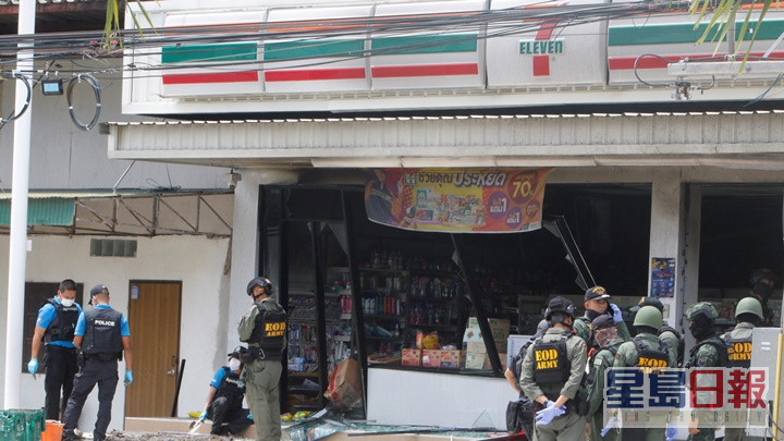 警員在爆炸損毀的便利店調查。路透社圖片