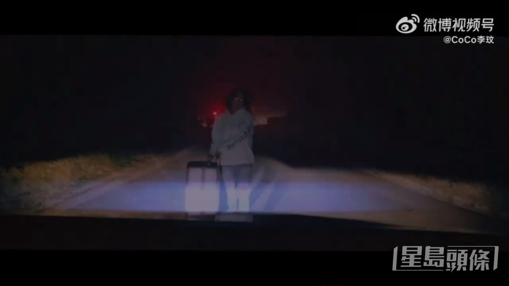 新歌預告片中，李玟拖著行李箱步上車。