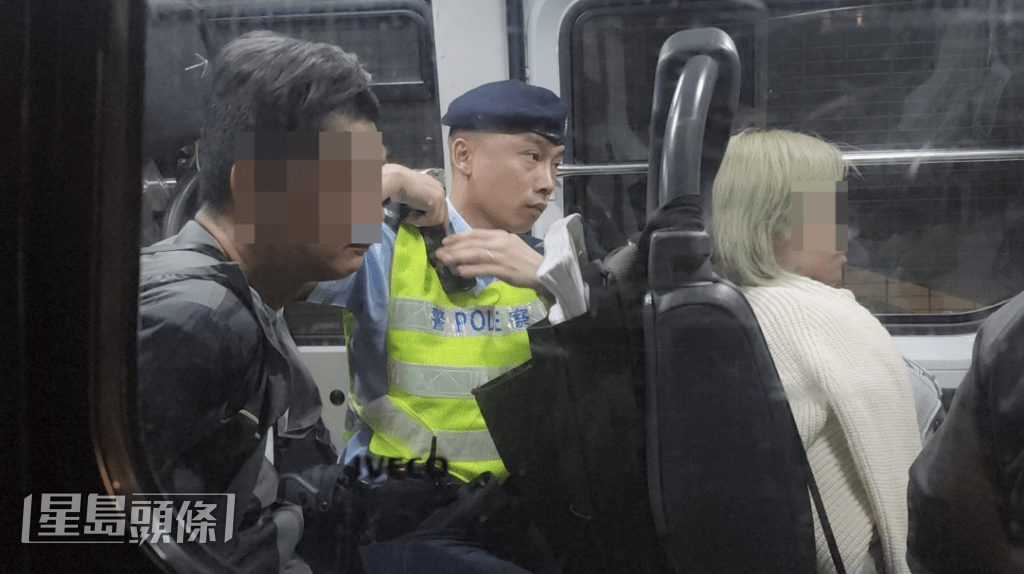 涉案男女由警車帶返警署調查。黎志偉攝 涉案男女由警車帶返警署調查。黎志偉攝