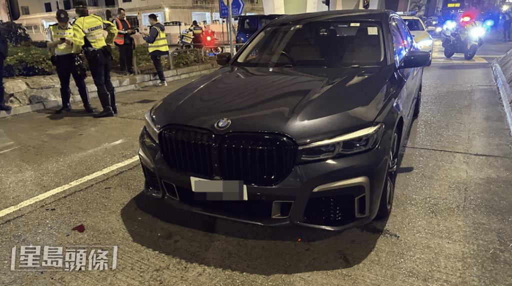 黑色寶馬私家車被波及。蔡楚輝攝 黑色寶馬私家車被波及。蔡楚輝攝