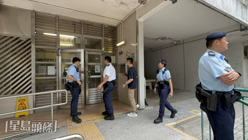 警方在愛德樓調查。梁國峰攝 警方在愛德樓調查。梁國峰攝