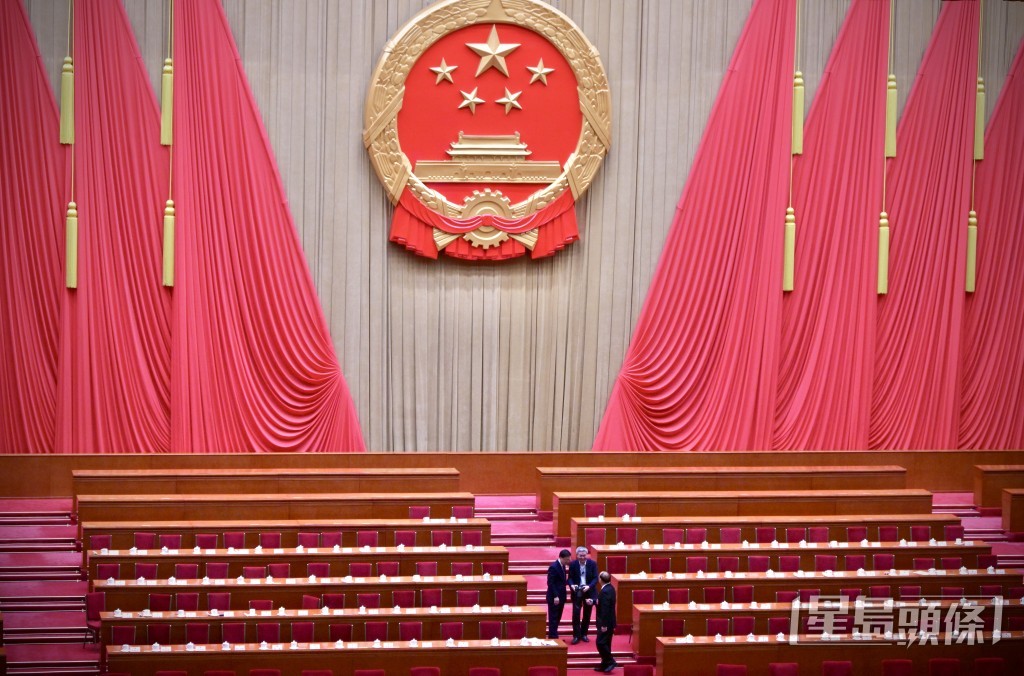 会议结束后，李家超与贺一诚独留合照。苏正谦摄