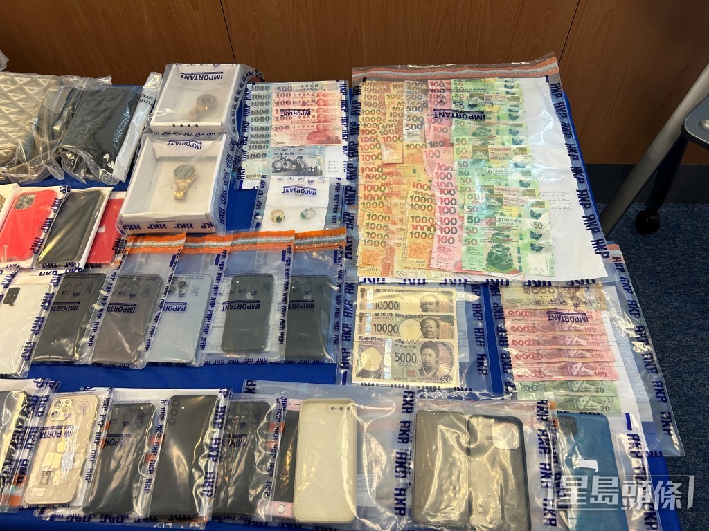 警方檢獲一批手機及現金。