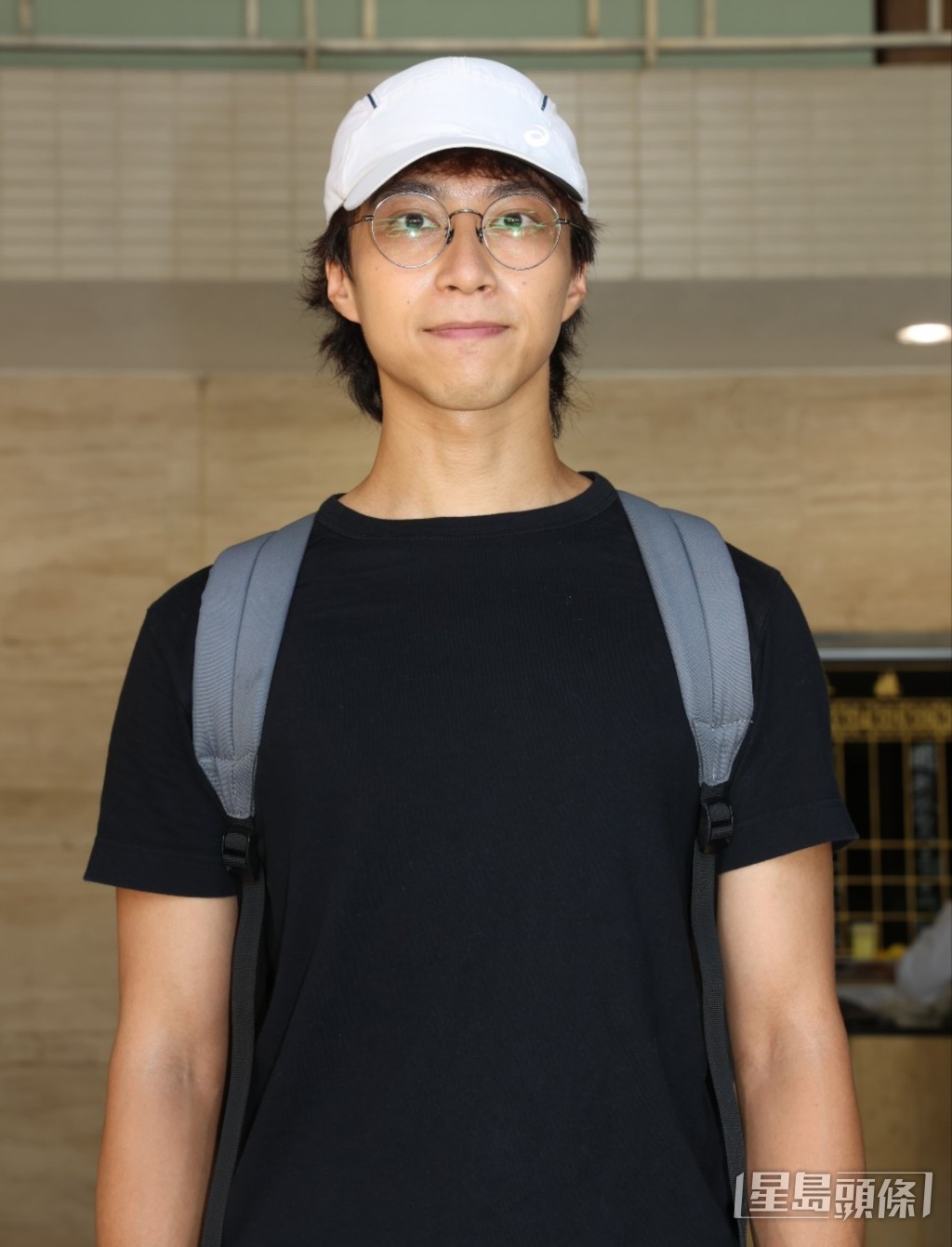吳業坤穿上黑衫到場。 吳業坤穿上黑衫到場。
