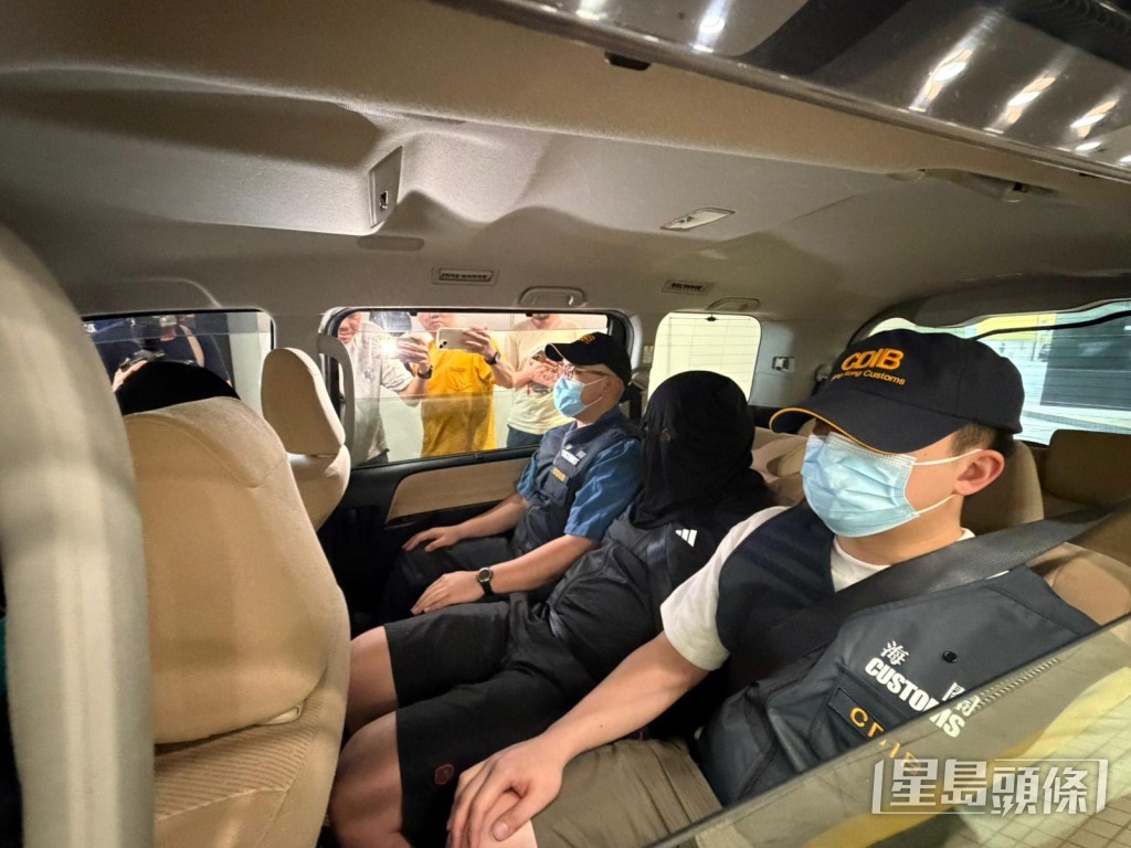 兩名被捕男女。曾志恆攝