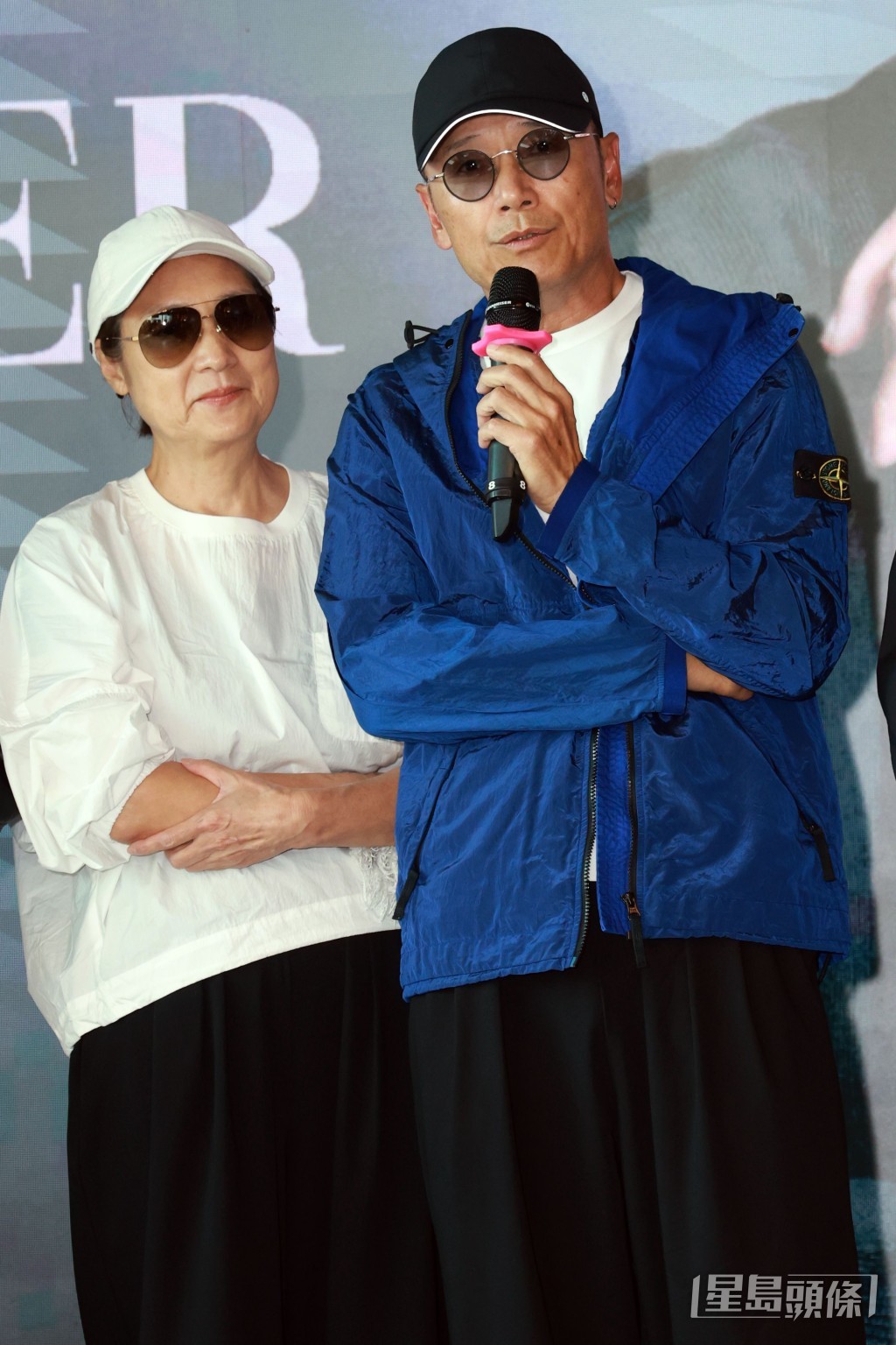 戚美珍、苗僑偉撐路易。