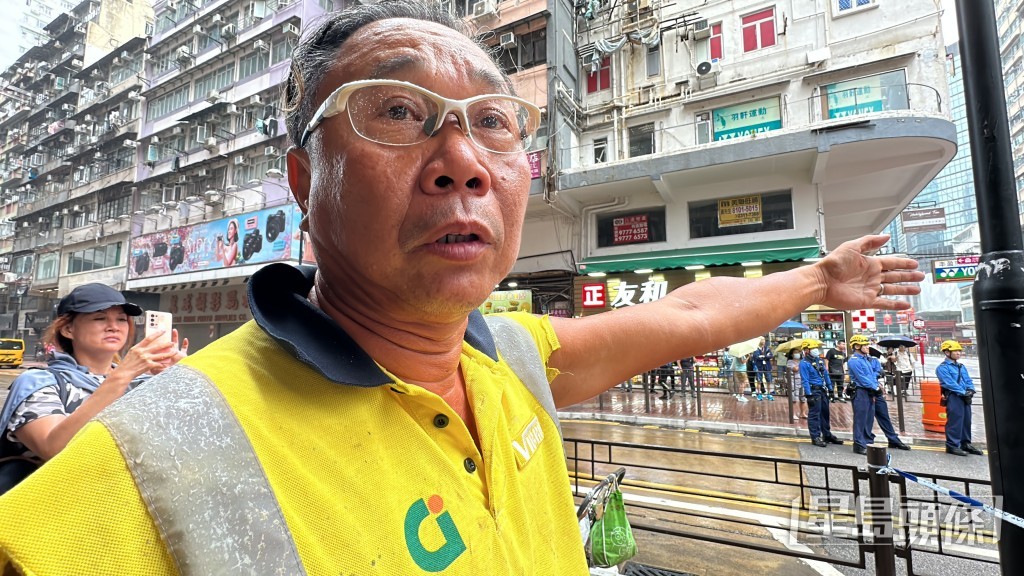 吊臂車工人蕭先生表示「一停車佢就擒上嚟！」劉漢權攝