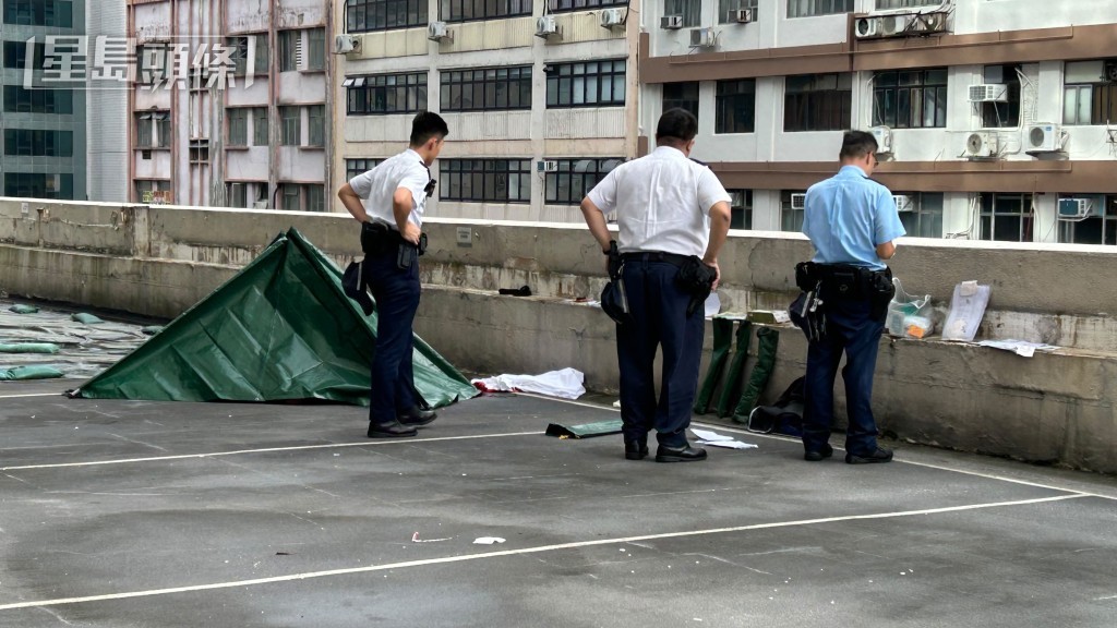 男子墮樓,伏屍停車場內。 男子墮樓,伏屍停車場內。