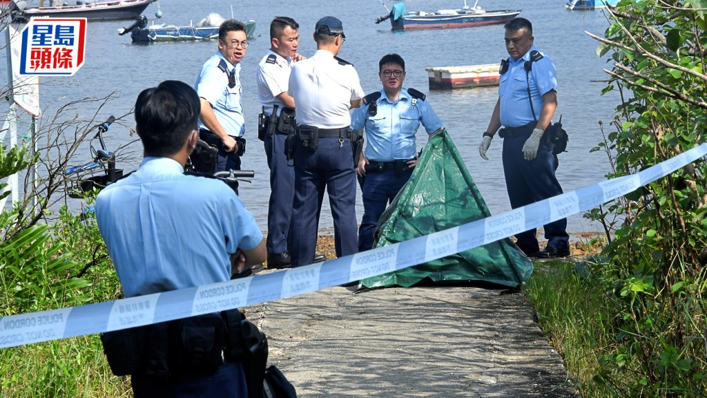 死者遺體以帳篷遮蓋。楊偉亨攝