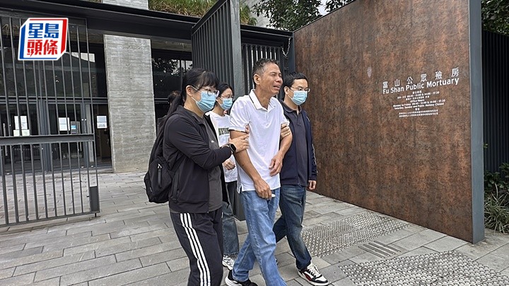 死者丈夫認屍後傷心離去。劉漢權攝