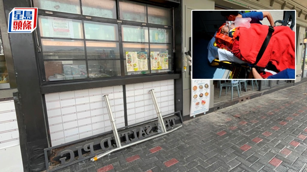 工人被墮下招牌擊中頭部昏迷送院。楊偉亨攝