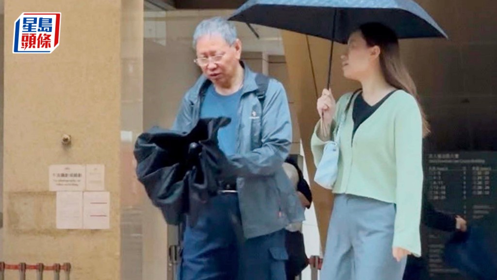 被告楊義亮（左）否認刑事恐嚇罪受審。雷璟怡攝