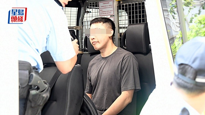 涉案司機被帶上警車調查。楊偉亨攝