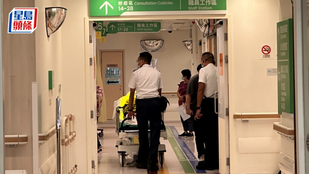 插腹女事主清醒送院治理。梁國峰攝