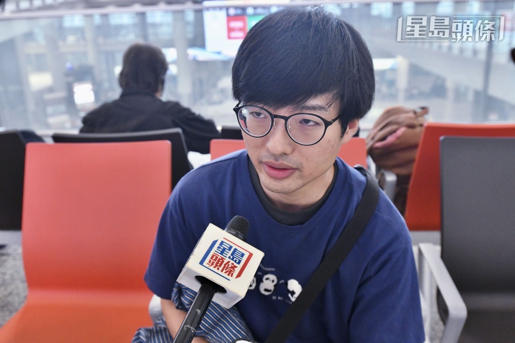 來自日本的Naoya來港旅遊數日，原定今早搭機離港，但因颱風延至明早。