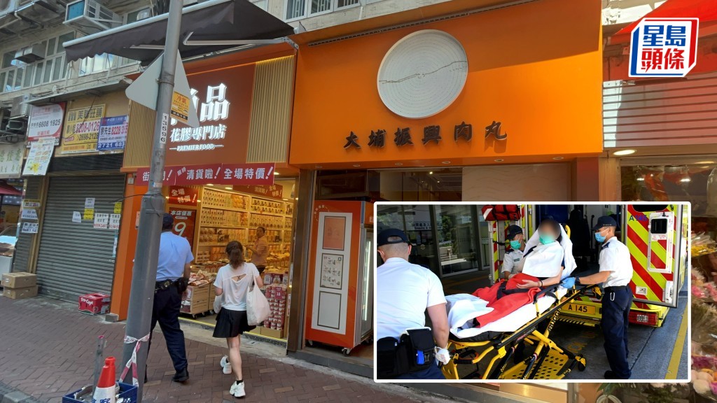 肉丸店圓形燈箱招牌墮下擊中女店員。楊偉亨攝