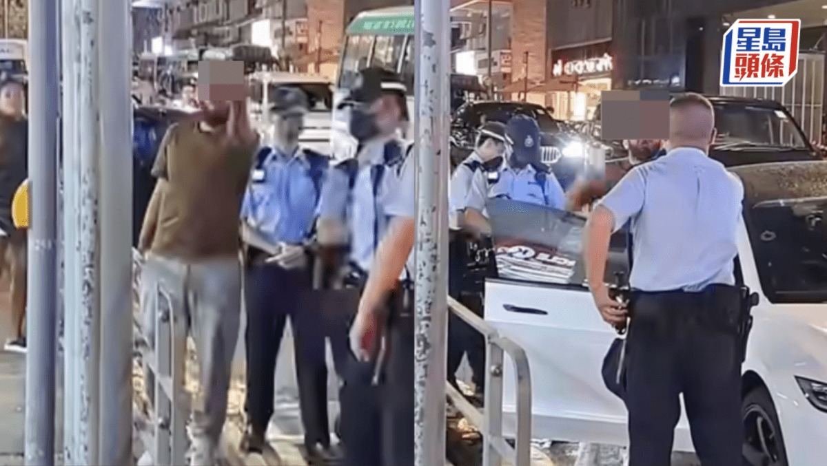 西環Tesla疑違交通例 外籍男爆粗與警爭執 向路人豎中指遭警喝止：唔好攞彩