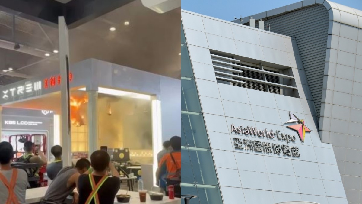 亞博館搭建中攤位展板起火 工人淡定圍觀