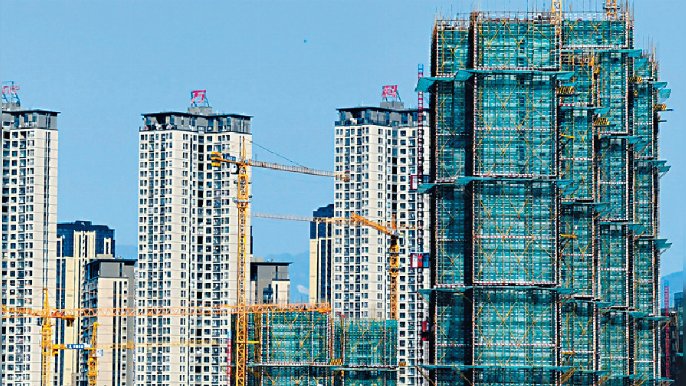 ■市場憧憬中央微調房策，成為內房股的強勁催化劑，對潤地有利。資料圖片
